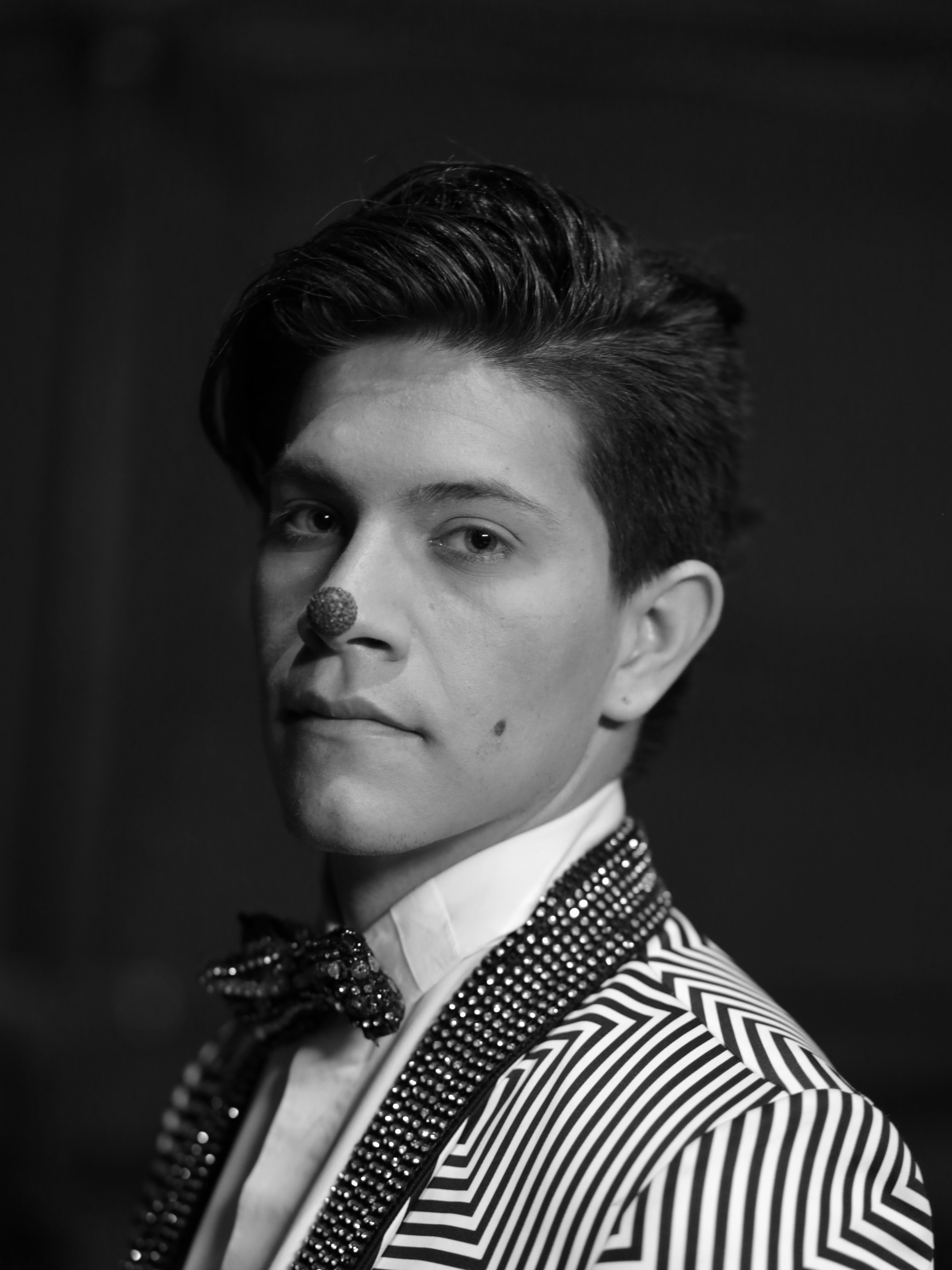 Black and white portrait of a circus clown.